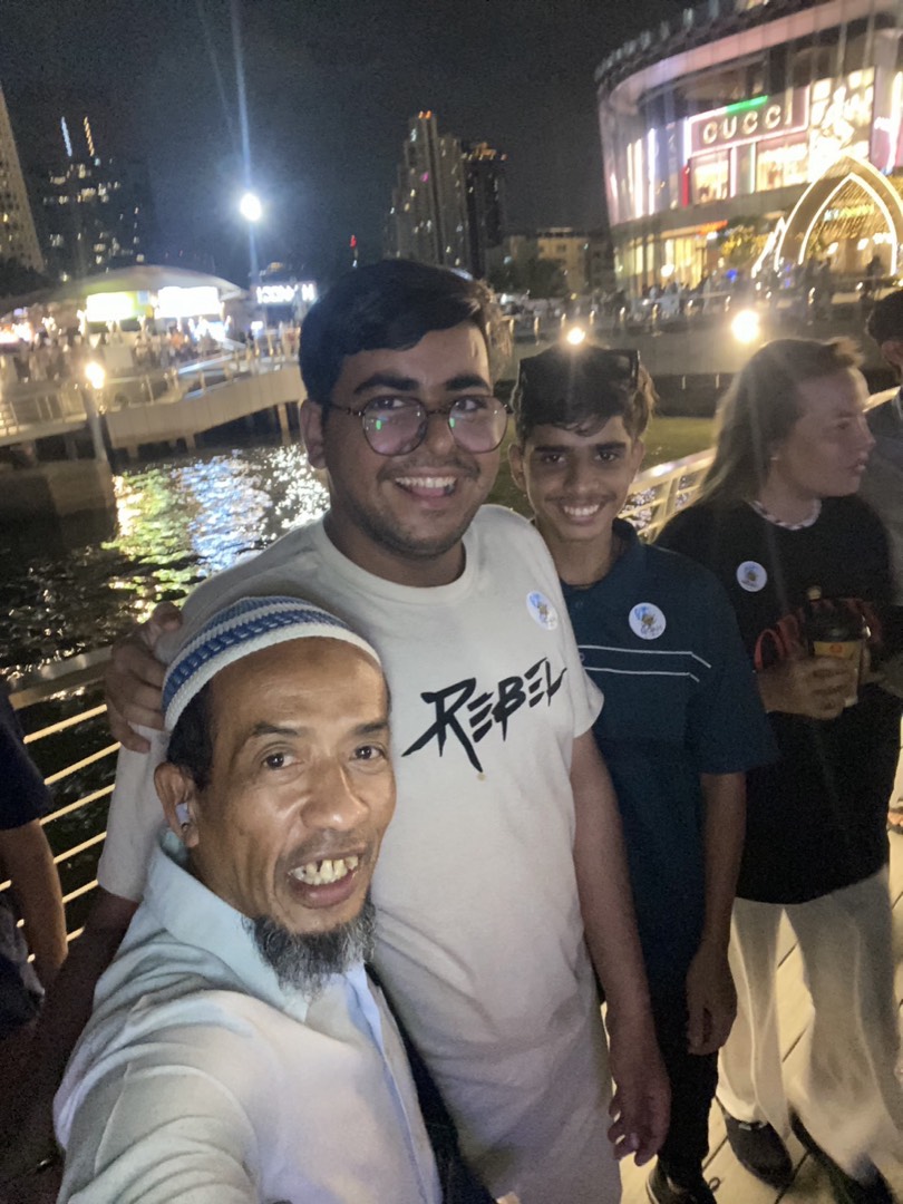 Sonny with young travellers on a night out by the river